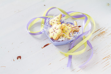 Easter cookies in heart shaped bowl