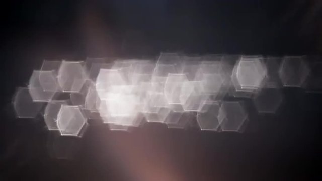Fast moving shining hexangular sparkles on dark background. Great unusual pattern for your design. Loopable. Full HD footage 1920x1080
