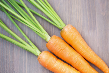 Raw carrots with green tops