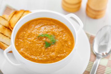 Delicious cream soup made of lentil on table, top view, close-up