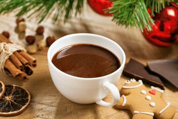 Obraz na płótnie Canvas Hot chocolate with gingerbread and cinnamon, Christmas traditional drink