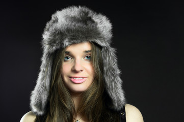 Portrait attractive girl in fur hat
