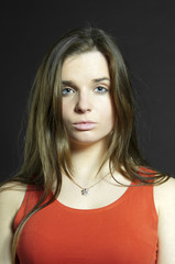Fototapeta premium Portrait sadly girl in red dress