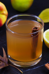 Glass of cider, apples and lemon