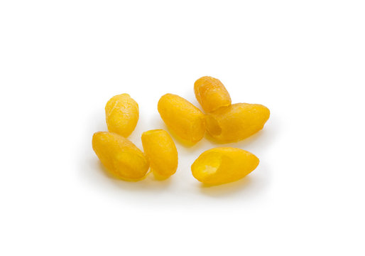 golden Thai silk cocoon soap on white background