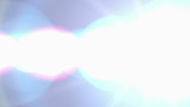 Blue colored lens flare transition with streaks and glare to an from white frame