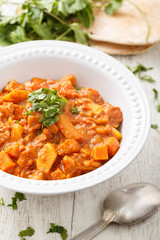 a bowl with ragout on the table