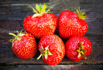 Beautiful strawberries on wooden background. Selective focus