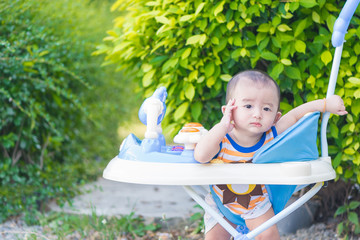 Asian baby in the baby walker