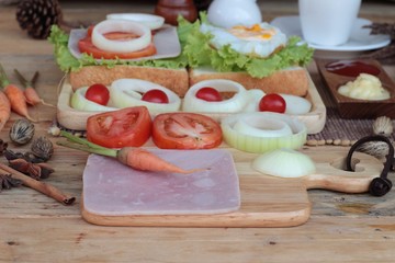 Slice bread ,ham ,fried eggs with breakfast.