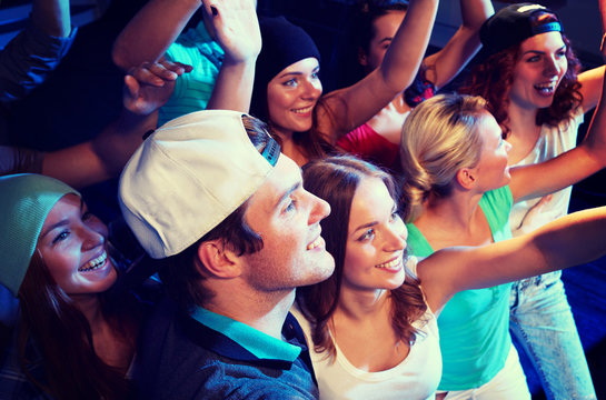 Smiling Friends At Concert In Club