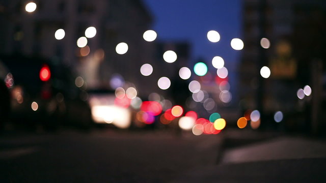 lights and colors of a sunset city in a urban context  defocuse and blurred near christmas time