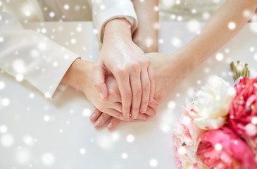 close up of happy lesbian couple with flowers