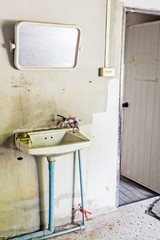 dirty washbasin and restroom