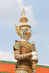White Thai giant demon Yaksha statue at Wat Phra Kaew temple in Bangkok Thailand.