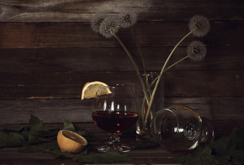 Glass of brandy with lemon