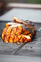 Salmon fish roast on barbecue grill.