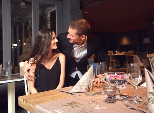 couple in love having dinner at a romantic restaurant