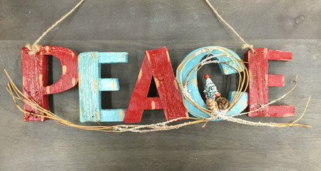 peace wood text with christmas tree