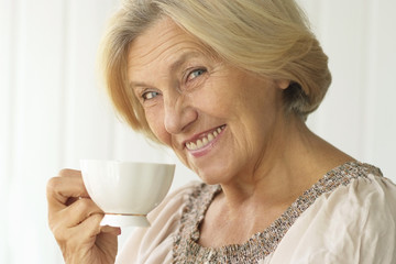 senior woman with cup of coffee