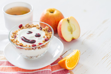 Granola and yogurt with smile face