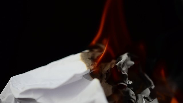 Fire and smoke from paper on a black background