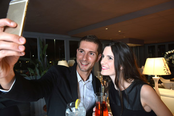 couple in love drinking cocktails