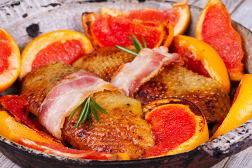 Roasted duck breast fillet with bacon, grapefruit and rosemary