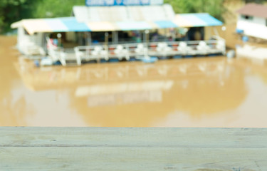 Empty wood table and river raft in background - Product display template