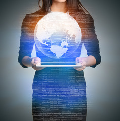 Close up Girl holding a digital globe over tablet