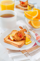 Bunny shaped toast with jam, juice and tea