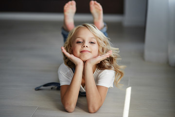 Teen beautiful girl in jeans clothes in the apartment