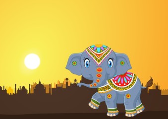 Cute elephant mascot wearing traditional costume on the sunset background