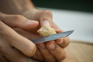 Guy cutting ginger
