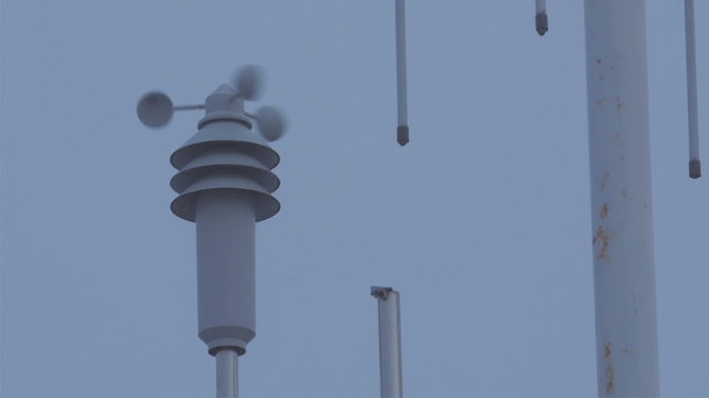 The anemometer turning on the breeze of the wind. This wind vane measures the speed of the wind