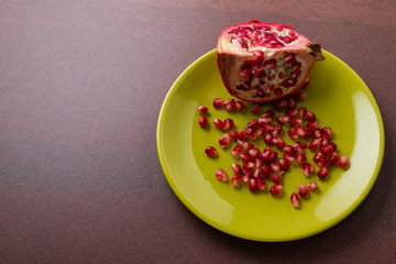 pomegranate on green plate