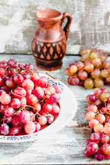 Fresh red grapes on the plate, whole plant foods,selective focus
