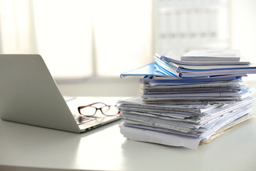office desk a stack of computer paper reports work forms
