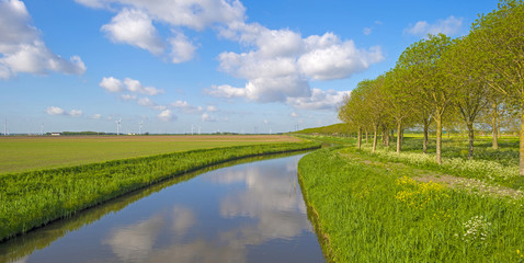 Canal meandering through the countryside in spring