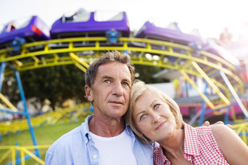 Senior couple at the fun fair