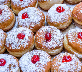 Fresh donuts on the display at bakery for Hanukkah celebration.