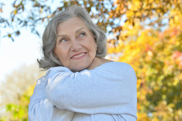 senior woman in  autumn park