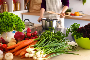 A young girl in kitchen while cooking