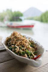 Thai spicy salad with three crispy varieties