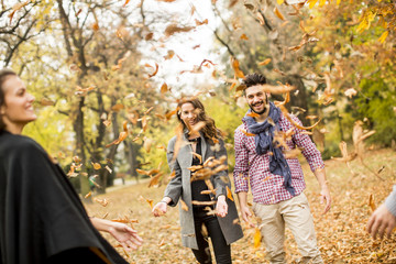 Young people having fun in the autumn park