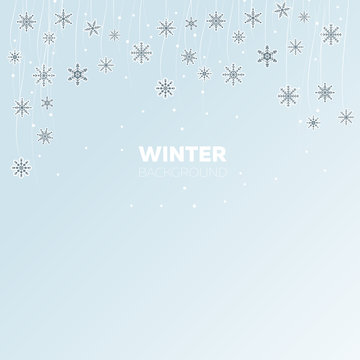Winter light blue background with snowflakes