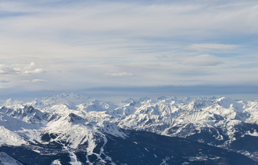 Fototapeta na wymiar Winter alpine mountain range aerial view panorama