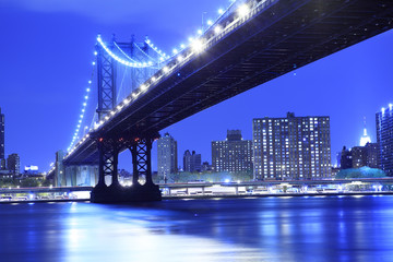 The Manhattan Bridge and Manhattan as seen from across the East River in the early evening.