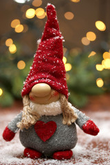 Christmas composition with textile gnome. Winter. New Year. Abstract light background.Selective focus.