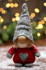 Christmas composition with textile gnome. Winter. New Year. Abstract light background.Selective focus.